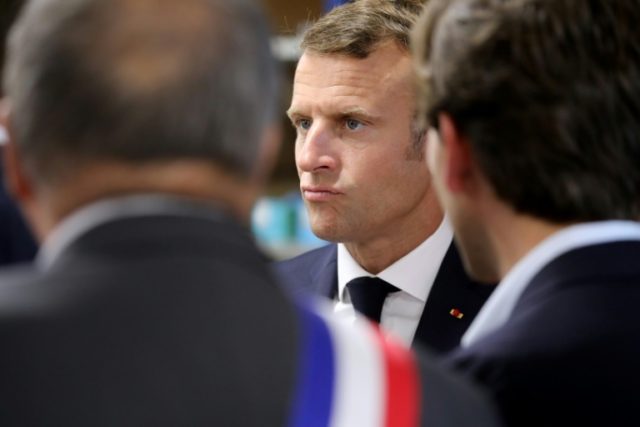 Macron signals tougher line on immigration