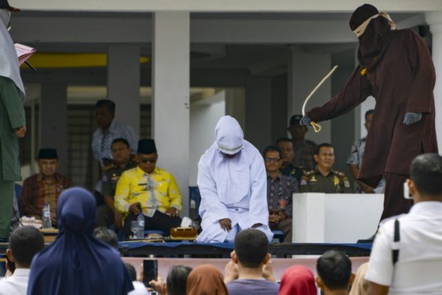 Couples flogged for public affection in Indonesia's Aceh