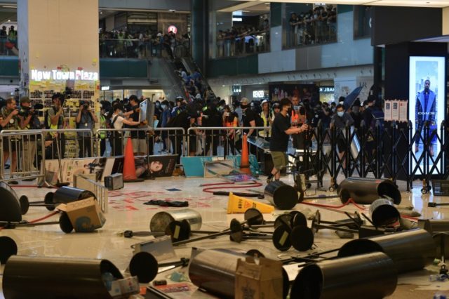 Hong Kong avoids airport protest but tensions rise at mall rally