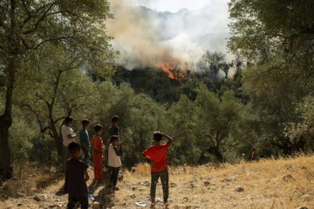 At least one dead in Greek migrant camp blaze