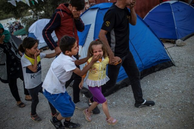 Two dead in Greek migrant camp blaze: report