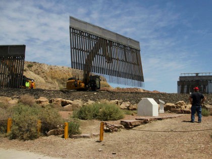 Workers build a border fence in a private property located in the limits of the US States of Texas and New Mexico taken from Ciudad Juarez, Chihuahua state, Mexico on May 26, 2019. (Photo by HERIKA MARTÍNEZ / AFP) (Photo credit should read HERIKA MARTINEZ/AFP/Getty Images)