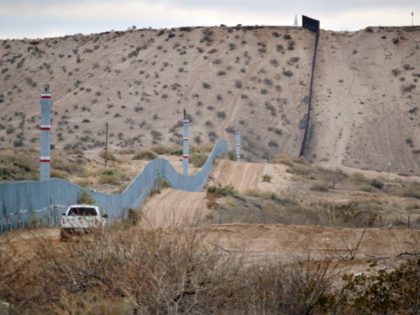 FILE - In this Jan. 4, 2016 file photo, a U.S. Border Patrol agent drives near the U.S.-Mexico border fence in Sunland Park, N.M. A new Cronkite News-Univision News-Dallas Morning News Border Poll released Monday, July 18, 2016, says a majority of residents surveyed on both sides of the U.S.-Mexico …