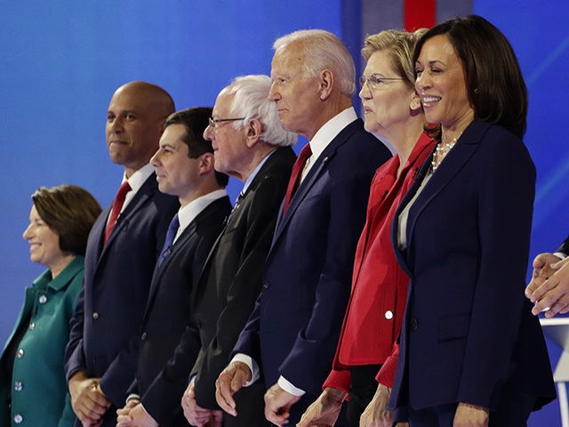 From left, Democratic presidential candidates Sen. Amy Klobuchar, D-Minn., Sen. Cory Booker, D-N.J., South Bend Mayor Pete Buttigieg, Sen. Bernie Sanders, I-Vt., former Vice President Joe Biden, Sen. Elizabeth Warren, D-Mass., Sen. Kamala Harris, D-Calif., entrepreneur Andrew Yang, former Texas Rep. Beto O'Rourke and former Housing Secretary Julian Castro are …