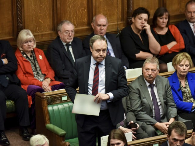 Northern Ireland's DUP (Democratic Unionist Party) deputy leader Nigel Dodds, centre, speaks during the Brexit debate inside the House of Commons in London Saturday Oct. 19, 2019. At the rare weekend sitting of Parliament, Prime Minister Boris Johnson implored legislators to ratify the Brexit deal he struck this week with …