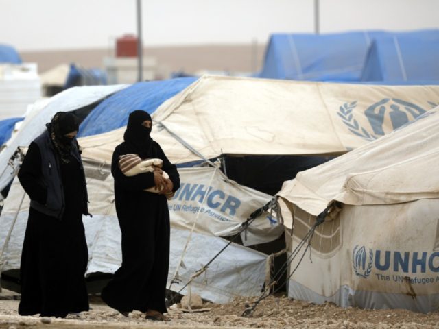 Displaced Syrians, from the eastern city of Deir Ezzor and Raqa who were forced to leave b