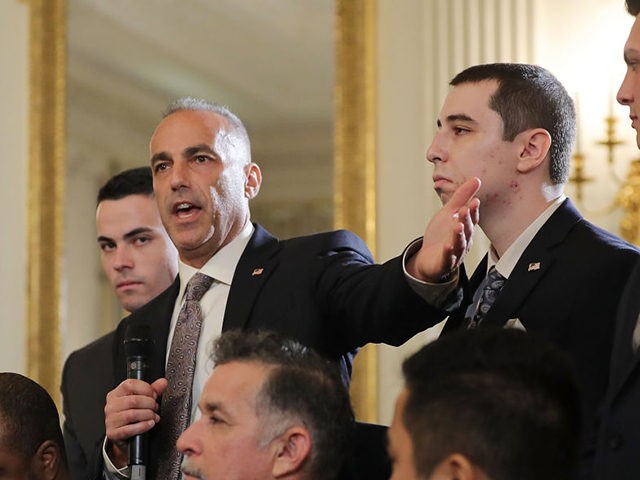 WASHINGTON, DC - FEBRUARY 21: (AFP OUT) Andrew Pollack (2nd L), whose daughter Meadow Pollack was shot to death last week at Marjory Stoneman Douglas High School, is joined by his sons as he addresses a listening session with U.S. President Donald Trump in the State Dining Room at the …