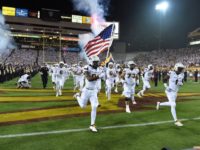 Arizona State football team holds flag