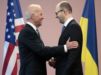 U.S. Vice President Joe Biden, left, talks with Ukrainian Prime Minister Arseniy Yatsenyuk during a meeting in Kiev, Ukraine, Tuesday, April. 22, 2014. Biden called on Moscow to encourage pro-Russia separatists in eastern Ukraine to vacate government buildings and checkpoints, accept amnesty and "address their grievances politically." (AP Photo/Sergei Chuzavkov)