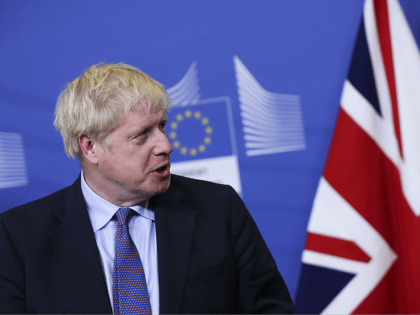 British Prime Minister Boris Johnson looks at European Commission President Jean-Claude Juncker as he reads a prepared statement during a press point at EU headquarters in Brussels, Thursday, Oct. 17, 2019. Britain and the European Union reached a new tentative Brexit deal on Thursday, hoping to finally escape the acrimony, …
