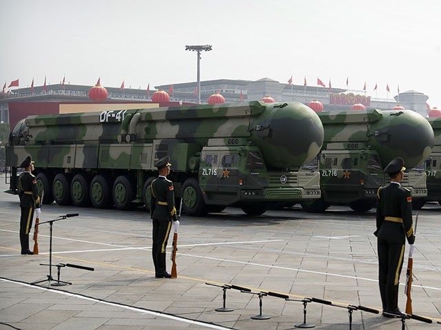 Chinese military vehicles carrying DF-41 ballistic missiles roll during a parade to commemorate the 70th anniversary of the founding of Communist China in Beijing, Tuesday, Oct. 1, 2019. Trucks carrying weapons including a nuclear-armed missile designed to evade U.S. defenses rumbled through Beijing as the Communist Party celebrated its 70th …