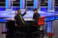Moderators Chuck Todd (L) speaks to audience during a technical problem alongside Rachel Maddow as they host the first night of the Democratic presidential primary debate hosted by NBC News at the Adrienne Arsht Center for the Performing Arts in Miami, Florida, on June 26, 2019. (Photo by JIM WATSON …
