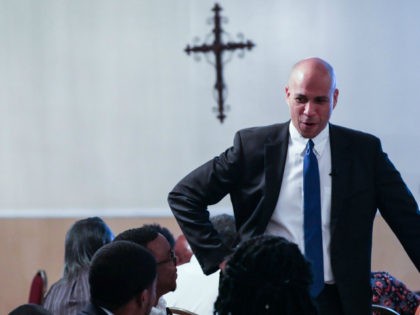 Senator Cory Booker addresses a crowd at a faith breakfast at Grace Christian Ministry in