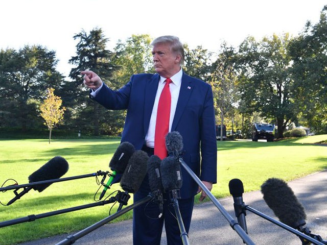 US President Donald Trump gestures as he speaks to the media prior to departing from the S