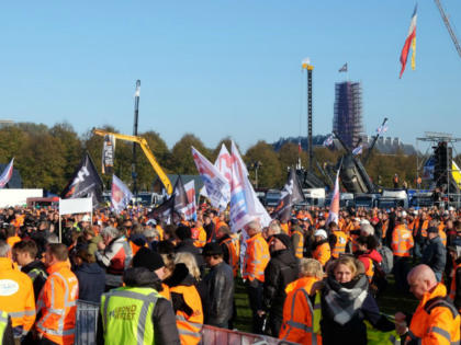 Dutch construction workers gather for a demonstration against the government’s environmental rules, in The Hague, Netherlands on Wednesday, Oct. 30, 2019. The industry is protesting government limits on nitrogen emissions and rules about transporting sand and earth contaminated with tiny amounts of chemicals known as PFAS. (AP Photo/Mike Corder)