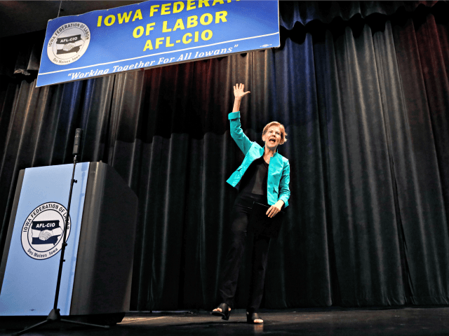 Democratic presidential candidate Sen. Elizabeth Warren waves to audience members after sp