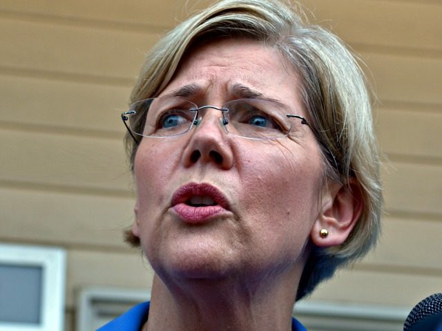 Harvard Law professor and consumer advocate, Democrat Elizabeth Warren, speaks to reporters outside the J & M Diner in Framingham, Mass., Wednesday, Sept. 14, 2011, during her first day of campaigning for a shot at challenging incumbent Republican Sen. Scott Brown in 2012 for his U. S. Senate seat. (AP …
