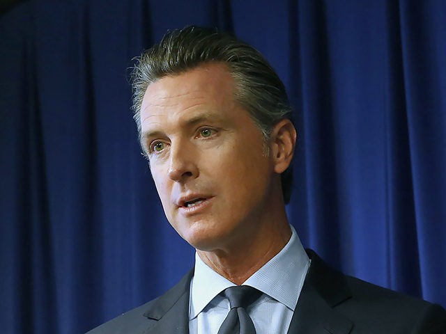 Gov. Gavin Newsom speaks at a news conference Wednesday, Sept. 18, 2019, in Sacramento, Calif. Newsom signed sweeping labor legislation that aims to give wage and benefit protections to rideshare drivers at companies like Uber and Lyft and to workers across other industries. (AP Photo/Rich Pedroncelli)