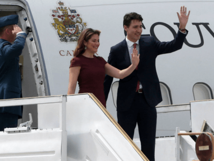BUENOS AIRES, ARGENTINA - NOVEMBER 29: Canadian Prime Minister Justin Trudeau and First Lady of Canada Sophie Gregoire Trudeau wave as they get off a plane on their arrival to Buenos Aires for G20 Leaders' Summit 2018 at Ministro Pistarini International Airport on November 29, 2018 in Ezeiza, Buenos Aires, …