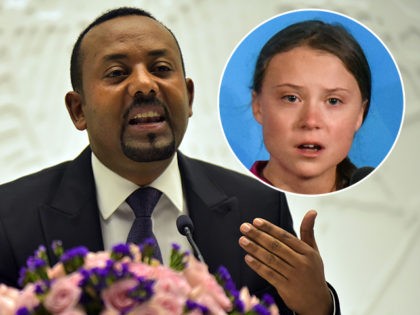 (INSET: Greta Thunberg) Ethiopia's Prime Minister Abiy Ahmed gives a press conference on August 1, 2019 at the Prime Minister's office in the capital, Addis Ababa. (Photo by MICHAEL TEWELDE / AFP) (Photo credit should read MICHAEL TEWELDE/AFP/Getty Images)