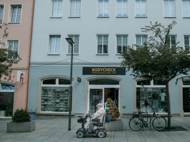 PRENZLAU, GERMANY - AUGUST 08: A man drives in a shopping street in Brandenburg state on A