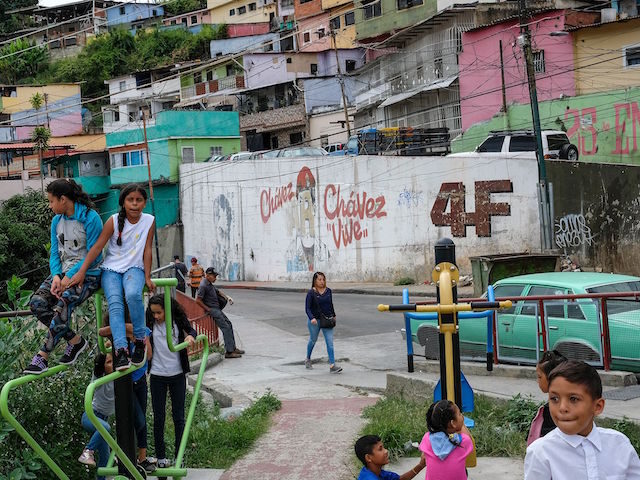 Children play at a park in 23 de Enero neighbourhood in Caracas on September 4, 2019. - In