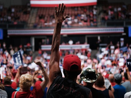 MANCHESTER, NEW HAMPSHIRE - AUGUST 15: People cheer as President Donald Trump speaks to supporters at a rally in Manchester on August 15, 2019 in Manchester, New Hampshire. The Trump 2020 campaign is looking to flip the battleground state of New Hampshire with the use of a strong economy and …