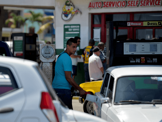 A man fills his car with fuel at a gas station in Havana, on September 19, 2019. - Cuban President Miguel Diaz Canel blamed the United States for Cuba's fuel shortage. In his address, he said the "low availability of diesel" will affect transport, distribution and electricity generation. The US …