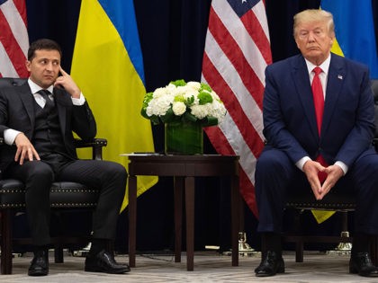 TOPSHOT - US President Donald Trump and Ukrainian President Volodymyr Zelensky looks on du