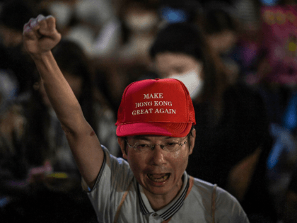 A man shouts slogans during a rally at Edinburgh Place in Hong Kong on September 27, 2019,