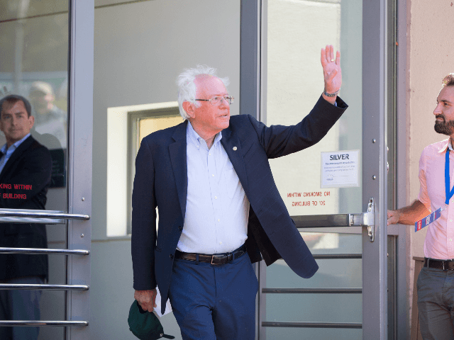 Democratic presidential candidate, Sen. Bernie Sanders (I-VT) waves as he walks towards th