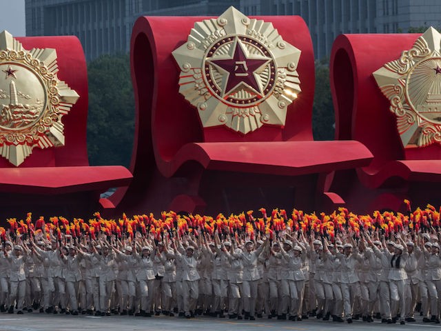 BEIJING, CHINA - OCTOBER 01: Chinese parade participants wearing communist style costume take part in a parade to celebrate the 70th Anniversary of the founding of the People's Republic of China in 1949, at Tiananmen Square on October 1, 2019 in Beijing, China. (Photo by Kevin Frayer/Getty Images)
