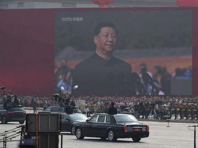 Chinese President Xi Jinping begins a review of troops from a car during a military parade at Tiananmen Square in Beijing on October 1, 2019, to mark the 70th anniversary of the founding of the People's Republic of China. (Photo by GREG BAKER / AFP) (Photo credit should read GREG BAKER/AFP/Getty Images)