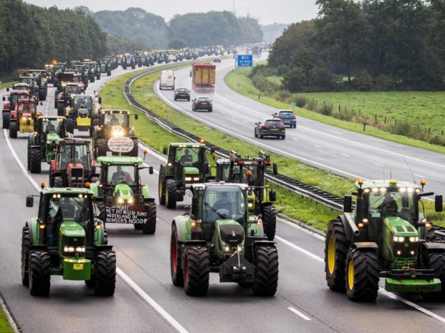 Farmers block the A28 Highway with their tractors between Hoogeveen and Meppel on October 1, 2019 during a national protest of farmers. - The farmers joined a national demonstration in The Hague to draw attention to their difficulties to comply with climate and environmental policy. (Photo by Vincent Jannink / …