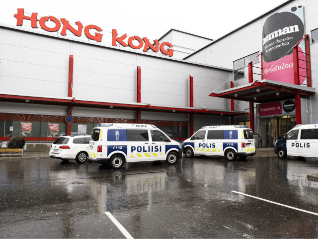 Police cars stand on the blocked grounds of the Hermanni shopping centre in Kuopio, Finlan