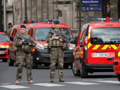 French soldiers stand guard near Paris prefecture de police (police headquarters) on October 3, 2019 after four officers were killed in a knife attack. - A man wielding a knife stabbed and killed four officers at the police headquarters in the heart of central Paris on Thursday, before being shot …