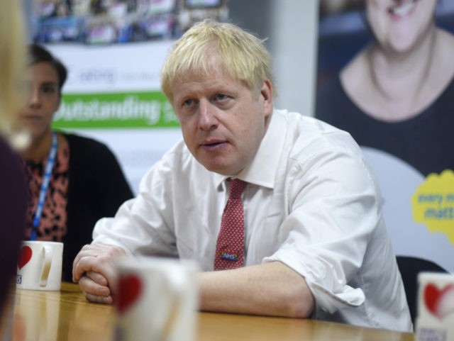 WATFORD, UNITED KINGDOM - OCTOBER 7: British Prime Minister Boris Johnson speaks to menta
