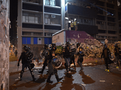 This photo taken on October 7, 2019 shows Hong Kong police taking position as protesters g