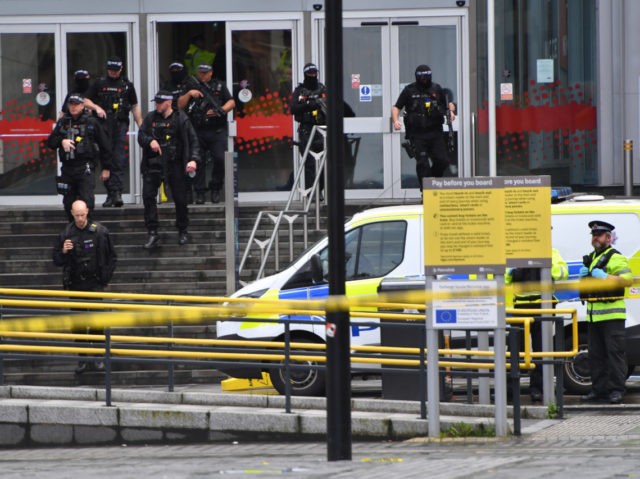 MANCHESTER, ENGLAND - OCTOBER 11: Armed police surround Arndale shopping centre, where a m