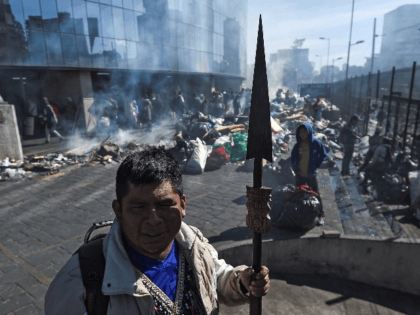 Indigenous people clean the Casa de la Cultura in Quito, on October 14, 2019, after Ecuador's president and indigenous leaders reached an agreement to end violent protests. - Ecuador's president and indigenous leaders reached an agreement to end nearly two weeks of violent protests against austerity measures put in place …