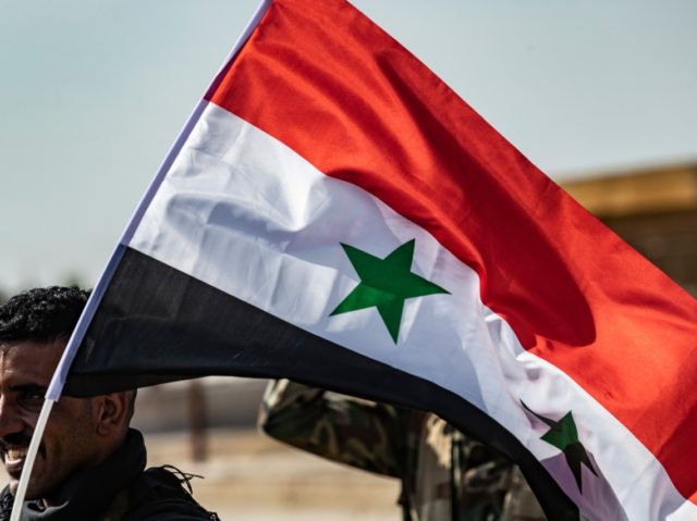 Syrian government forces arrive in the town of Tal Tamr, not far from the flashpoint Kurdi