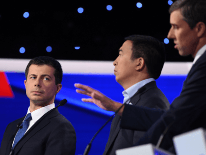 Democratic presidential hopeful Mayor of South Bend, Indiana Pete Buttigieg (L) looks on a