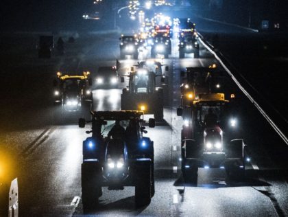 Farmers drive their tractor in Staphorst, early on October 16, 2019 as they are on their way to a demonstration against the nitrogen policy rules, taking place at the National Institute for Health and Environment (Rijksinstituut voor Volksgezondheid en Milieu) in Bilthoven. (Photo by Siese VEENSTRA / ANP / AFP) …