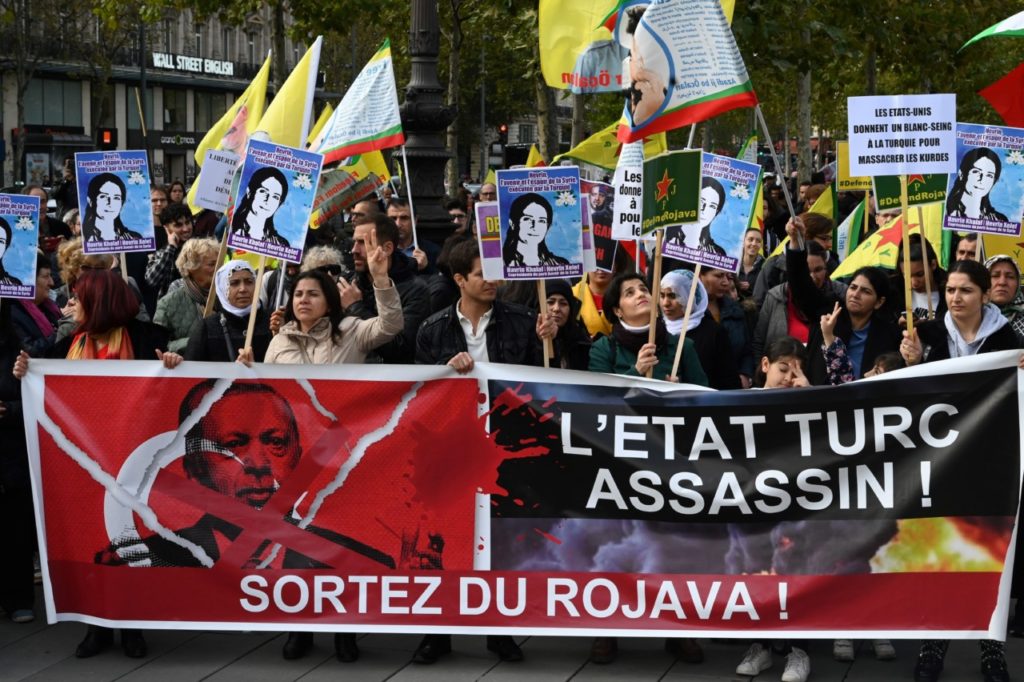 Kurdish demonstrators protest against Turkey's president and Turkish military action in northern Syria on October 19, 2019 on the place de la Republique in Paris. - Turkish President on October 19, 2019 warned that Turkey would "crush the heads" of Kurdish forces if they did not withdraw from a proposed safe zone along the border under a US-brokered deal. (Photo by DOMINIQUE FAGET / AFP) (Photo by DOMINIQUE FAGET/AFP via Getty Images)
