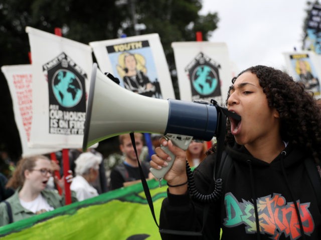 SAN RAMON, CALIFORNIA - SEPTEMBER 27: A youth climate activist uses a bullhorn as she leads a chant during a Climate Strike youth protest outside of Chevron headquarters on September 27, 2019 in San Ramon, California. Hundreds of youth climate activists and their supporters staged a Climate Strike protest outside …