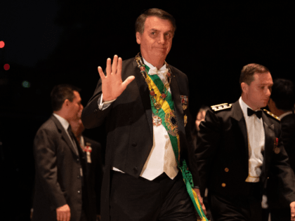 Brazil's President Jair Bolsonaro arrives at the Imperial Palace for the court banquet in