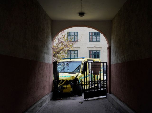 A stolen ambulance car that crashed into a house is pictured on October 22, 2019 in Oslo,