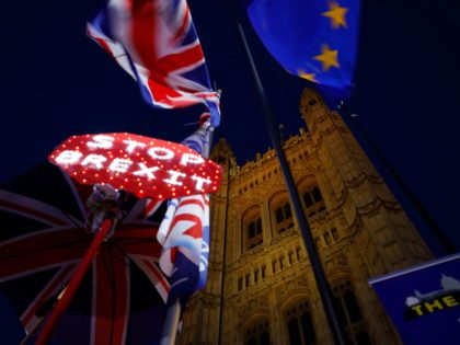 Banners, Union and EU flags are displayed outside the Houses of Parliament in London on Oc