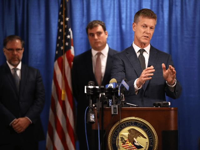 United States attorney David L. Anderson (R) speaks during a news conference on September