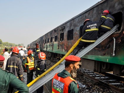 Firefighters work to cool down the burnt-out train carriages after a passenger train caught on fire near Rahim Yar Khan in Punjab province on October 31, 2019. - At least 71 people were killed and dozens injured after cooking gas cylinders exploded on a train packed with pilgrims in Pakistan …